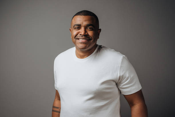 Portrait of a man wearing white t-shirt in studio